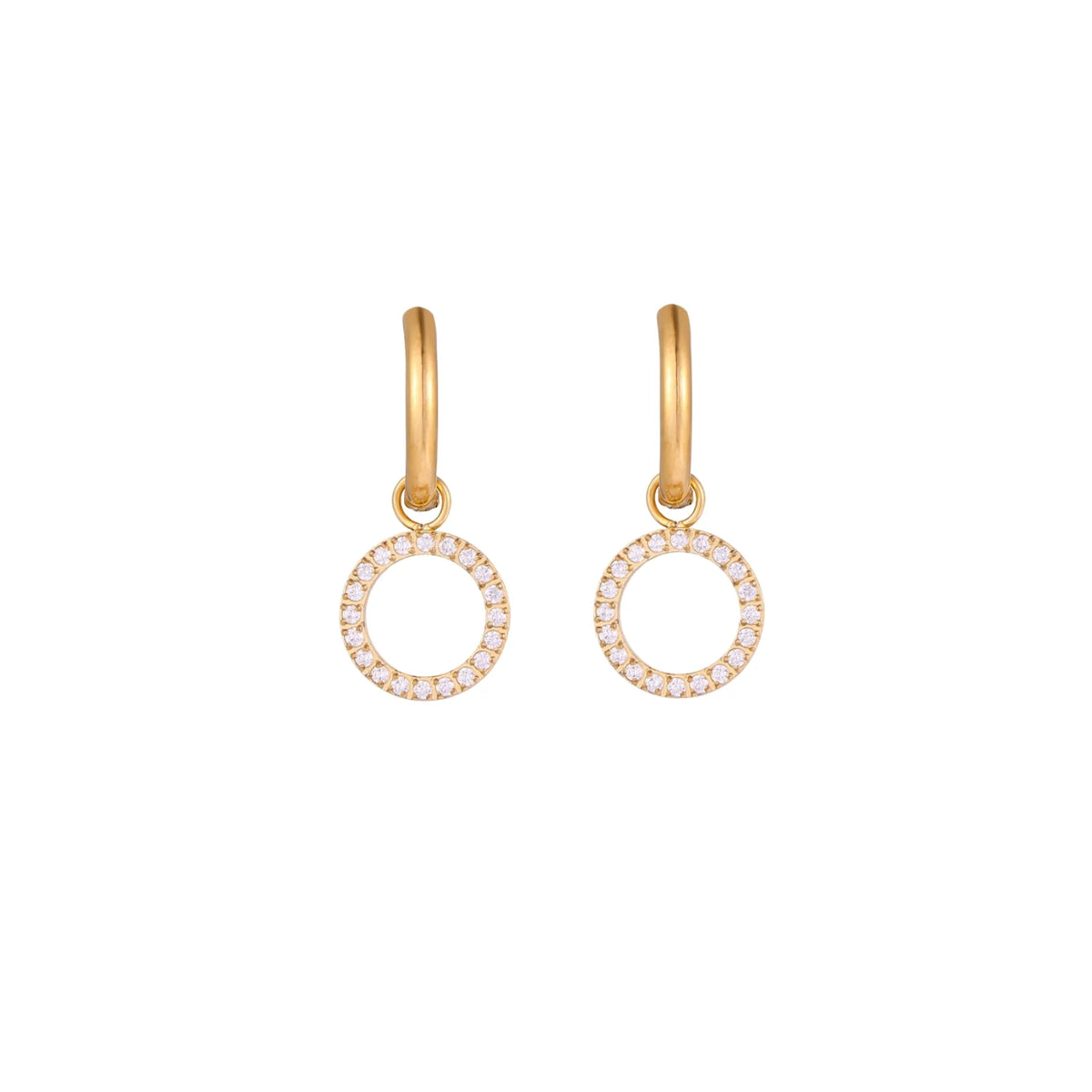Gold-plated huggie hoop earrings with CZ-studded open circle charms on beige background
