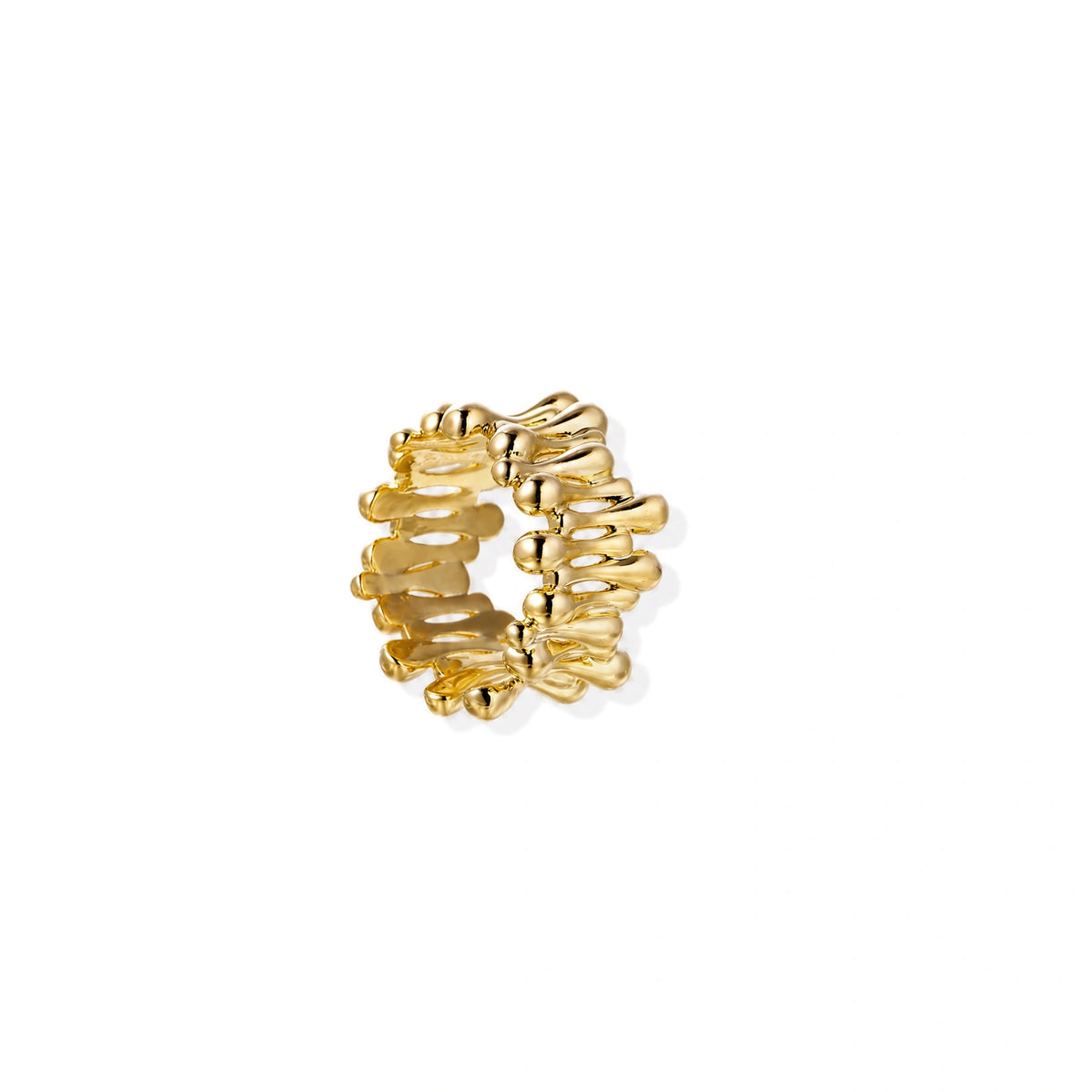Gold-plated brass ring with sculptural petal-like elements in a wide band design on beige background
