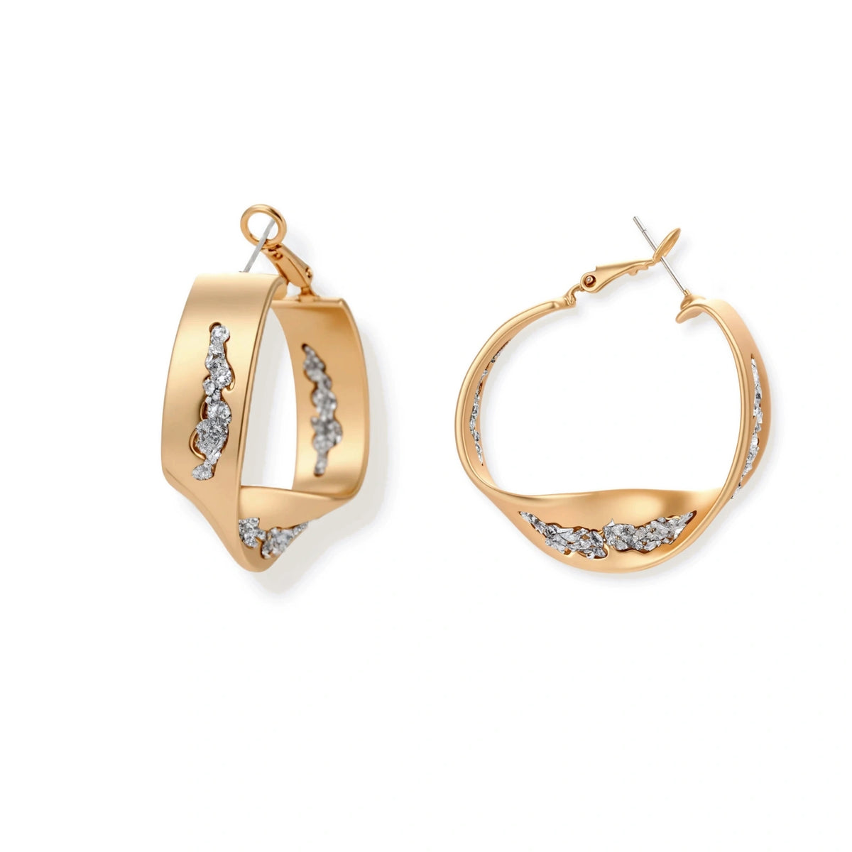 Organic-shaped gold hoop earrings with scattered crystals, featuring hinged closure on white background.