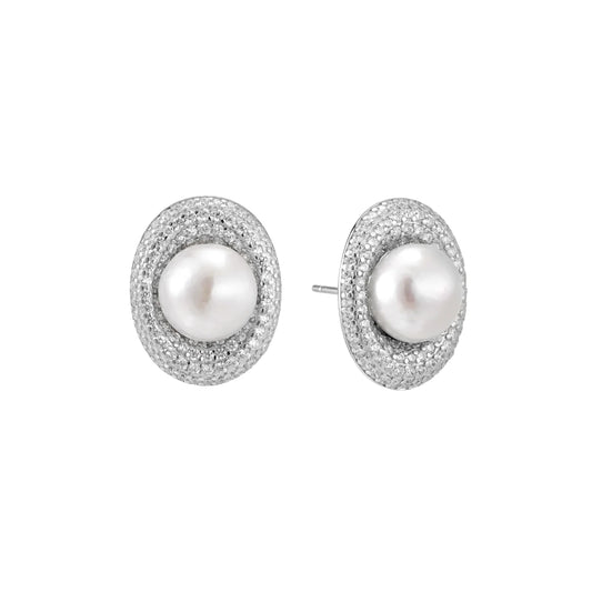 Oval rhodium-plated silver studs featuring freshwater pearls surrounded by pavé crystal halo on white background