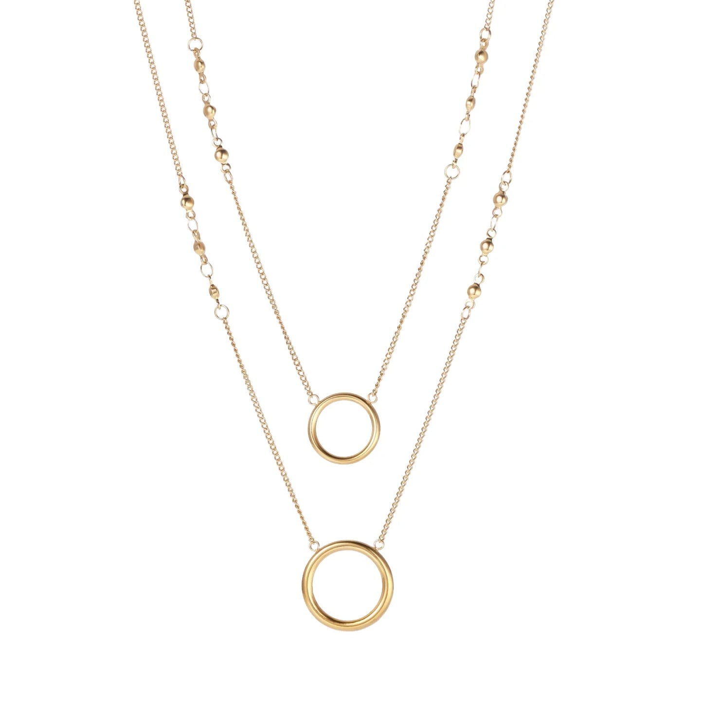 Layered gold necklace set with two open circle pendants and mixed chain styles on beige background