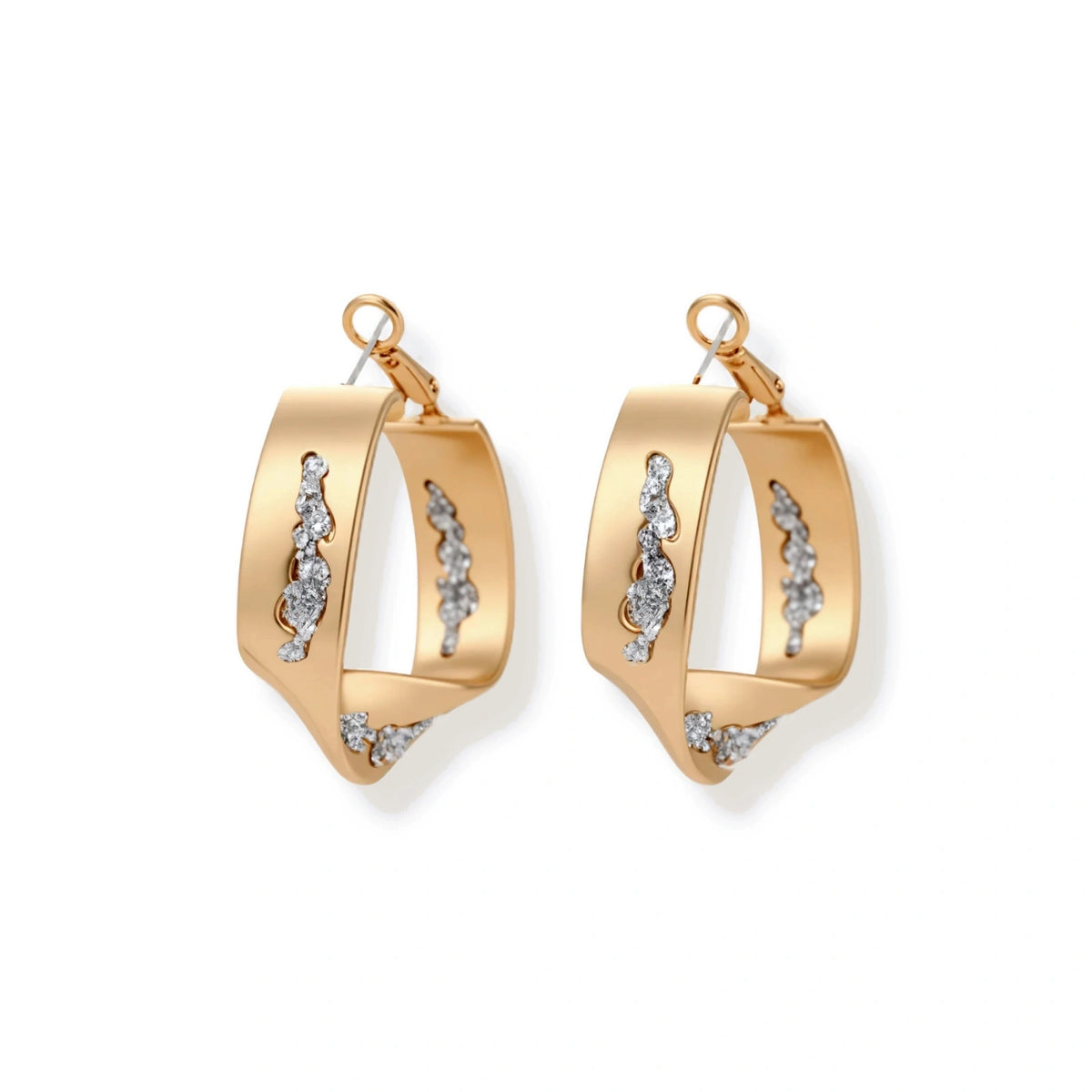 Organic-shaped gold hoop earrings with scattered crystals, featuring hinged closure on white background.