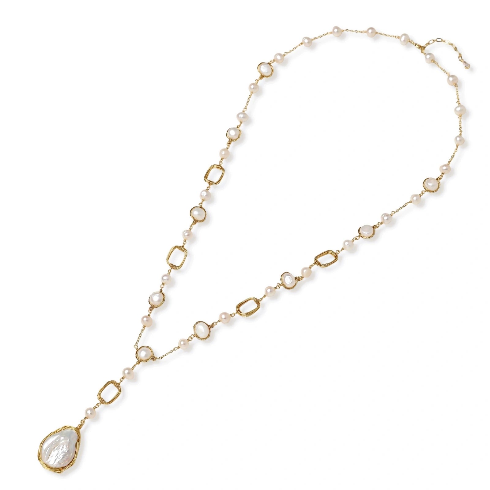 Long gold-plated necklace with alternating freshwater pearls and crystal bezels, featuring a large baroque pearl pendant