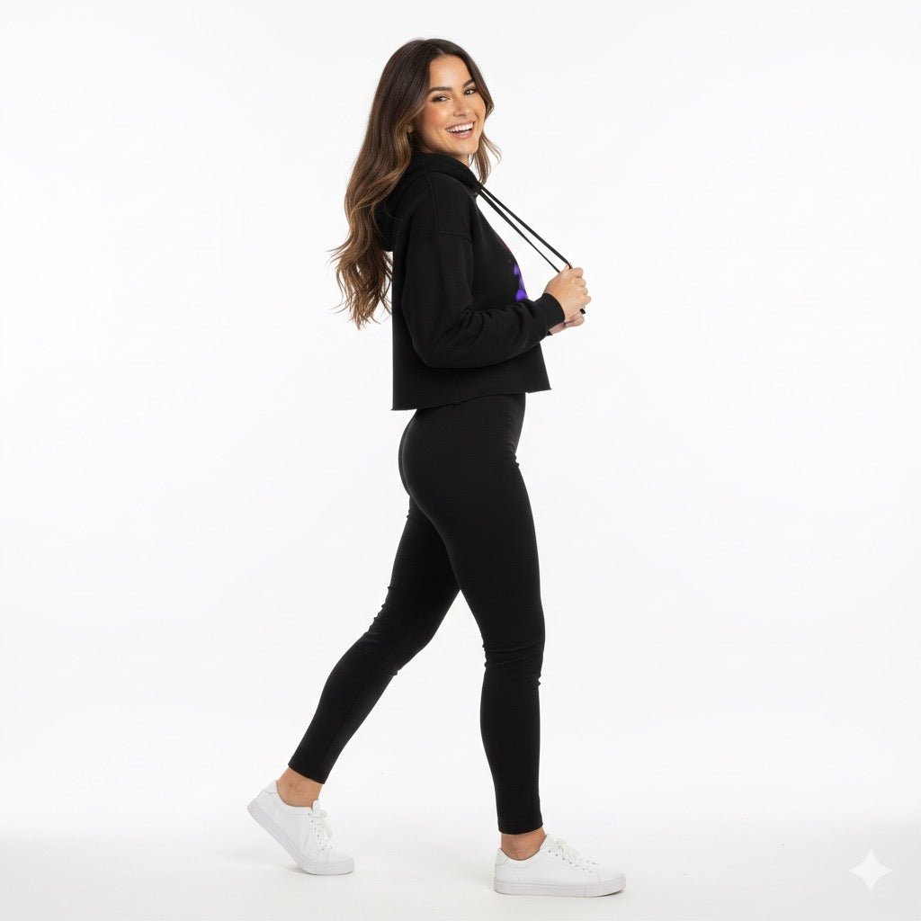 Girl wearing a black pullover side view with leggings outfit with a white background